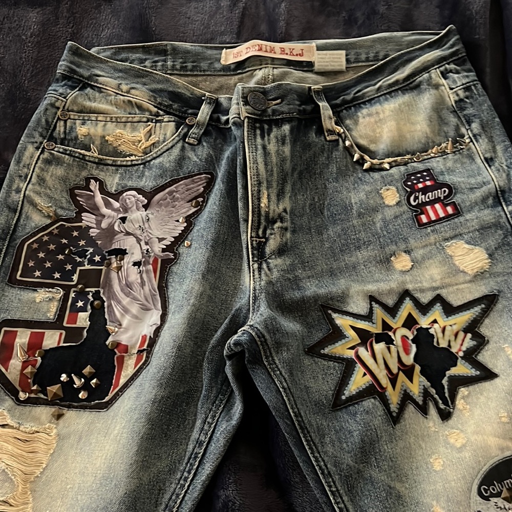 Size 38 Buckaroo destroyed jeans with patches and spikes.